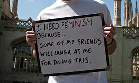 male feminist student holding whiteboard cambridge