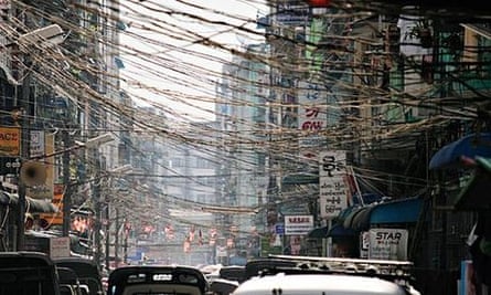Traffic on a city street in Yangon, Burma.