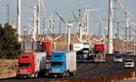 COP15: US carbon emissions from diesel trucks passing windmills of windfarm near Banning, California