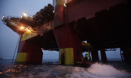 Cairn Energy's Stena Don oil rig is scaled by Greenpeace campaigners, Greenland