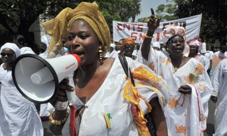 MDG : Feminism and development : Women march during a rally to mark May Day in Dakar