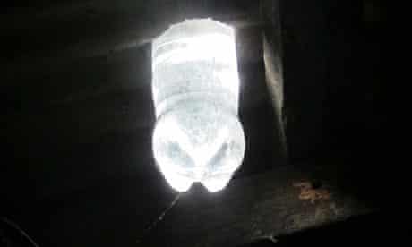 Scheme in Phillipines where plastic bottles are put in shanty home roofs to provide light