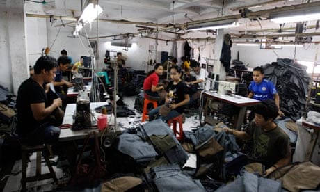 MDG : Sweatshop in Asia : Indonesian laborers work at a local garment factory in Jakarta, Indonesia