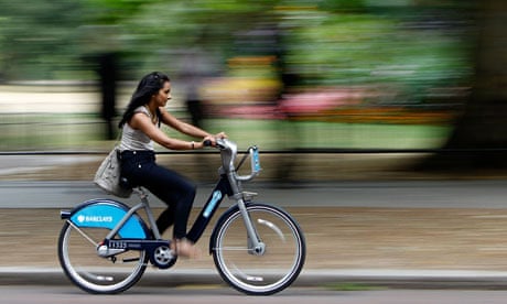 Bike blog :  A woman cycles past St James Park after the launch of London's cycle hire scheme