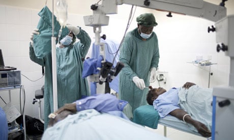 MDG : Getting out of poverty , Lusaka , Zambia : Doctors perform cataract surgery