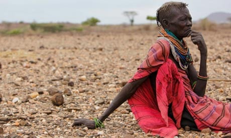 MDG : Horn Of Africa famine : An ethnic Turkana woman sits on the ground in Turkana, Kenya
