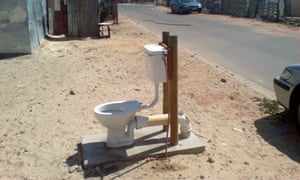 An open air toilets  installed by the City of Cape Town next to the road in Khayelitsha South Africa