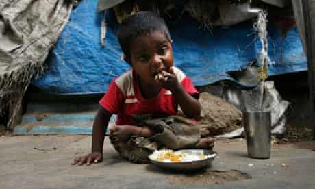 MDG : Malnutrition in India : An Indian child eats mid-day meals, Hyderabad , Andhra Pradesh