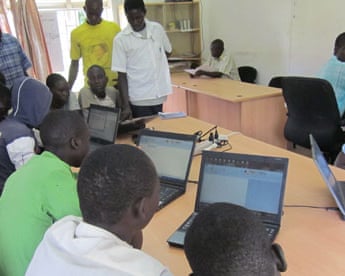 MDG : People using computers gat use computers in the AMREF community media centre, Katine office