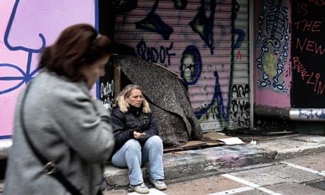 MDG : EU crisis : A woman begs for money in central in Athens , Greece