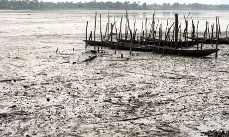 Fishing boats lie abandoned in oil-polluted water near Bodo, Nigeria.