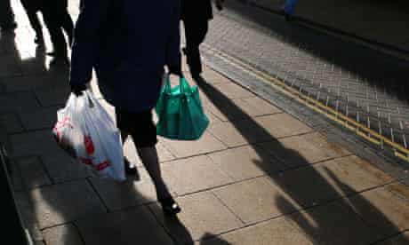 A shopper holds a plastic bags in Diss, Norfolk