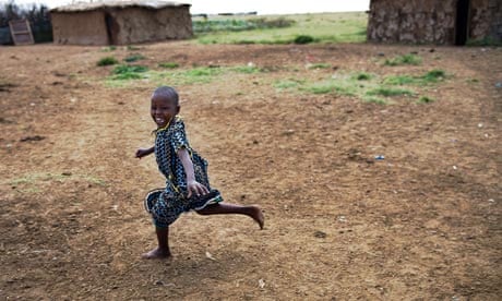 MDG : Development and wellbeing : Happy young Masai girl  in Kenya