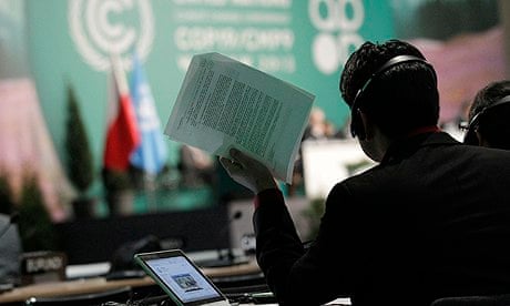 COP19 in Warsaw : man holds documents