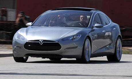 Tesla S all-electric sedan car out into the street