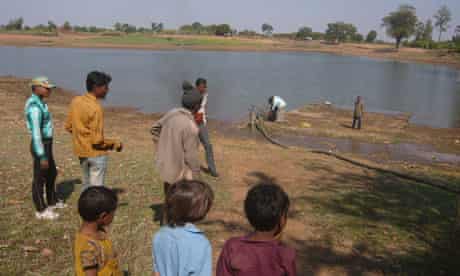 MDG : Eficor : pond in village near Dungarpur in southern Rajasthan, India