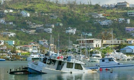 MDG : A boat floats partially submerged September 11, 2004 near St. George's, Grenada