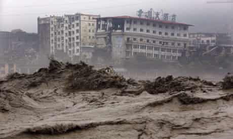 Climate change adaptation : Floods in Sichuan China:  heavy flood waters sweeping through Beichuan 