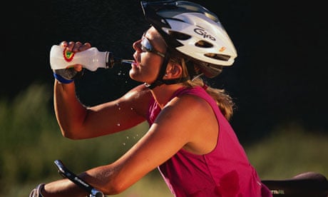 Bike Blog : Woman cyclist Having a Drink of Water