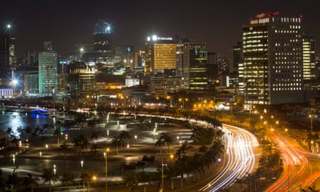 MDG : Africa ghost town : city skyline and promenade stand illuminated at night in Luanda, Angola