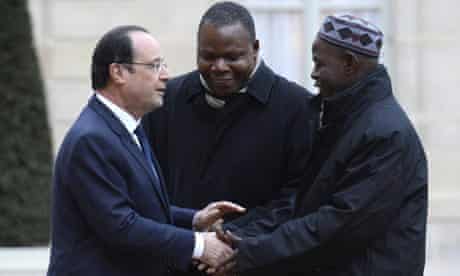 MDG : François Hollande greets Oumar Kobine Layama and Dieudonné Nzapalainga 