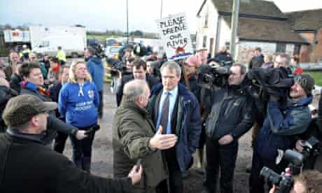 Environment Secretary Owen Paterson confronted by residents during visit in Northmoor, Somerset