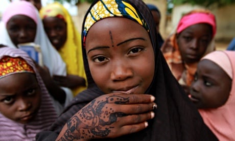 MDG : A schoolgirl displays a traditional henna design on her hand in Kano, Nigeria