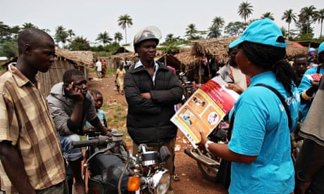 MDG Unicef working with a leaflet about Ebola