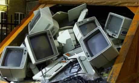Old computer terminals in a skip