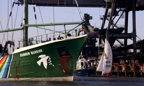 Activists from the Greenpeace flagship Rainbow Warrior enter the pier outside Kingsnorth power station in Medway, Kent