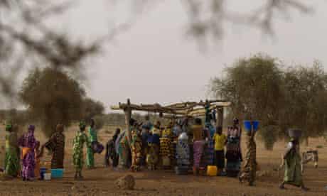 Women crowd around a well in the Matam region of north-eastern Senegal