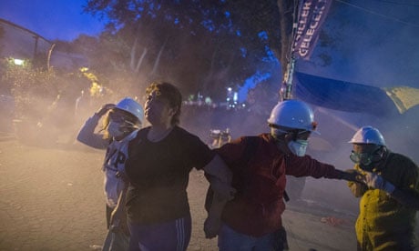 Protestors escape from tear gas during the crackdown action at Gezi Park 