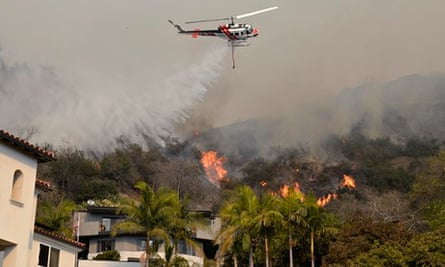 California fire :  so-called the "Colby Fire" : A helicopter drops water 