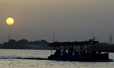 Sudanese villagers ride in their boat at the river Nile in Sudan's capital Khartoum