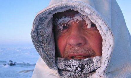 wildlife cameraman Doug Allan in freezing conditions on Kong Karl's Land, Svalbard, Norway