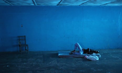 MDG : A man lies in a newly-opened Ebola isolation center, Monrovia, Liberia