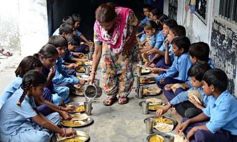 MDG : India school free meal : schoolchildren eat their free midday meal at a government school