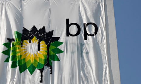  Greenpeace activists place a banner with the British Petroleum (BP) Logo