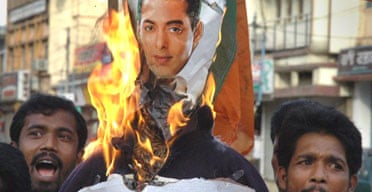 Protesters burn a poster of actor Salman Khan