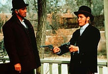 Terence Stamp and Emilio Estevez in Young Guns (1988)