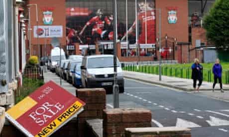 Liverpool for sale: An estate agent's board in the garden near Anfield