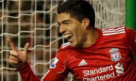 Liverpool's new signing, Luis Suarez, celebrates scoring against Stoke City on his debut