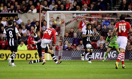 Robbie Findley of Nottingham Forest scores against Newcastle