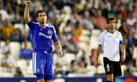 Chelsea's Frank Lampard, left, celebrates his goal in front of Valencia's David Albelda