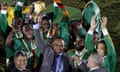 Zambia's Kalusha Bwalya holds the trophy