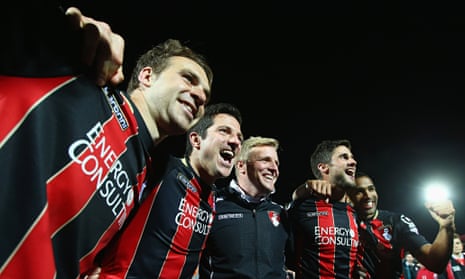 Eddie Howe, third from left, celebrates with his Bournemouth players after the win over Bolton
