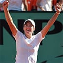 Justine Henin-Hardenne celebrates after winning the French Open