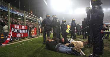 Police guard detained fans in Lens