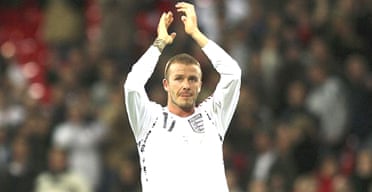 David Beckham applauds the fans as he leaves the pitch