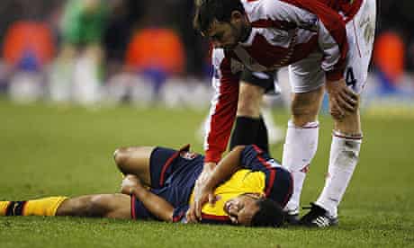 Theo Walcott lies injured